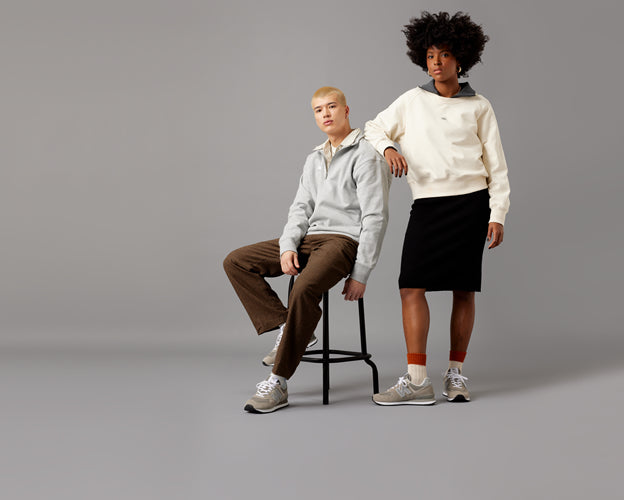 Men and women both wearing New Balance trainers